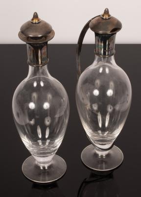A pear-shaped claret jug and