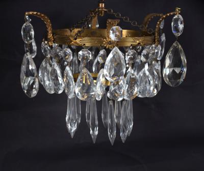 A pendant ceiling lustre, the two