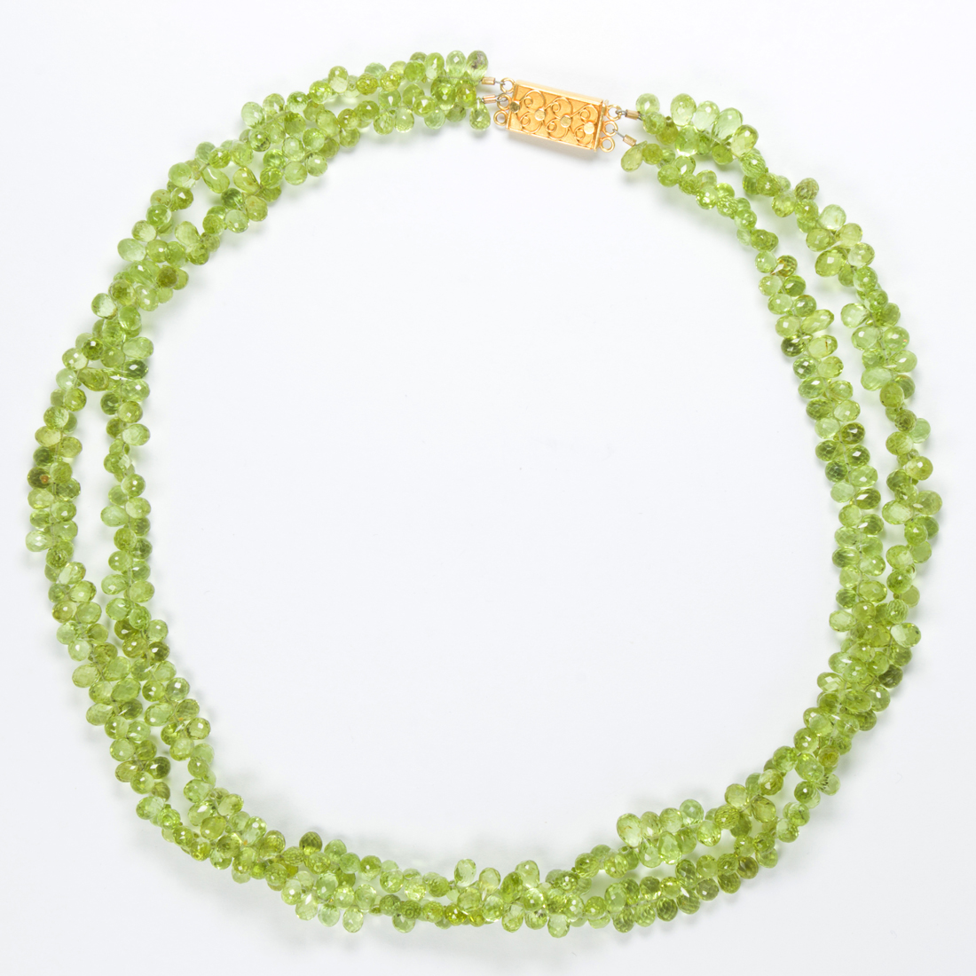 A PERIDOT AND EIGHTEEN KARAT GOLD