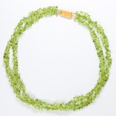 A PERIDOT AND EIGHTEEN KARAT G