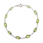 A PERIDOT AND EIGHTEEN KARAT W