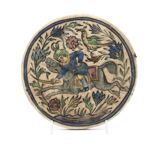 A Persian Ceramic Plaque of