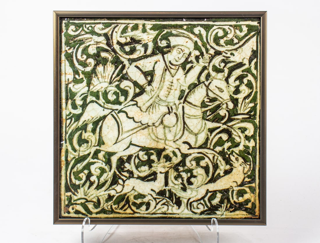 A PERSIAN FAIENCE TILEA Persian
