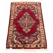A PERSIAN HAMADAN CARPET A Per