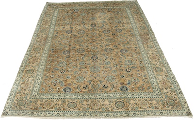 A Persian Ivory Mashad Carpet