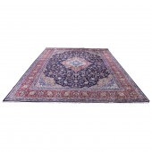 A PERSIAN KASHAN CARPET A Pers