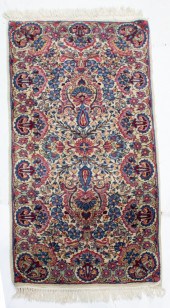 A PERSIAN KERMAN RUNNER A Pers