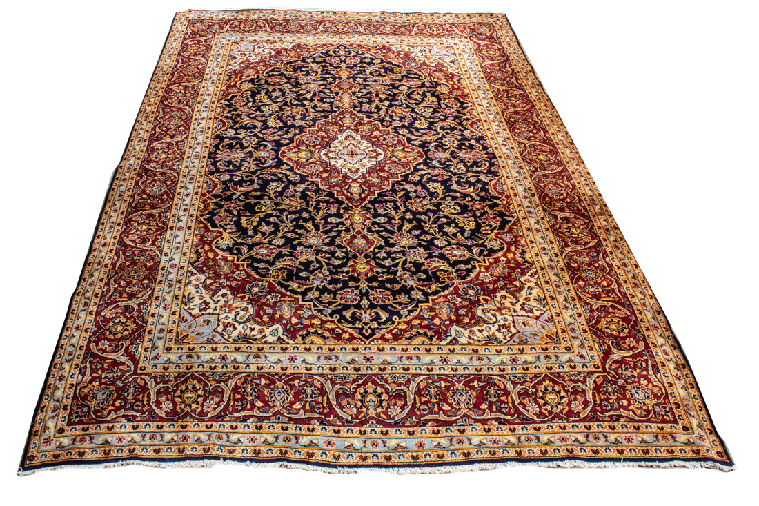 A PERSIAN MASHAD CARPET A Persian