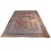 A PERSIAN MASHAD CARPET A Pers