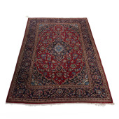 A PERSIAN MESHED CARPET<br>A P