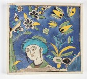 A PERSIAN POTTERY FIGURAL TILE
