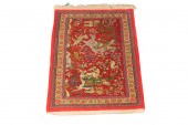 A PERSIAN QUM CARPET A Persian