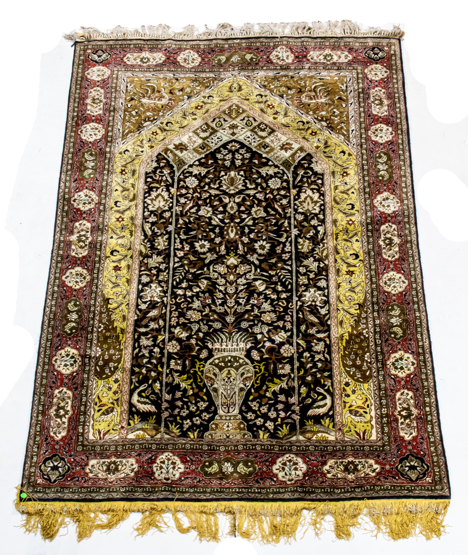 A PERSIAN QUM SILK CARPET A Persian