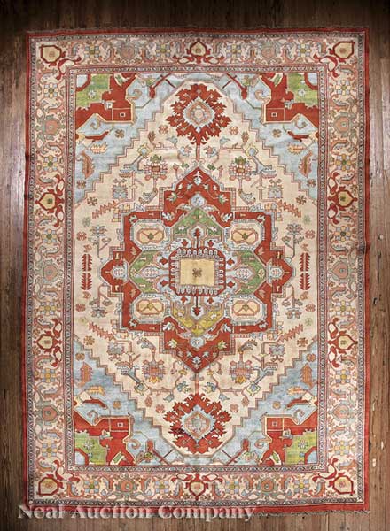 A Persian Serapi Carpet cream and