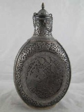 A Persian silver cased glass b