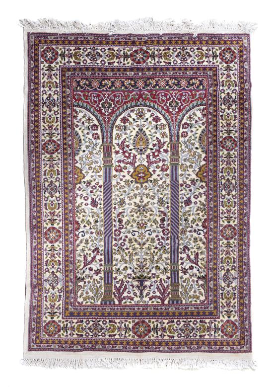 A Persian Wool Prayer Rug decorated