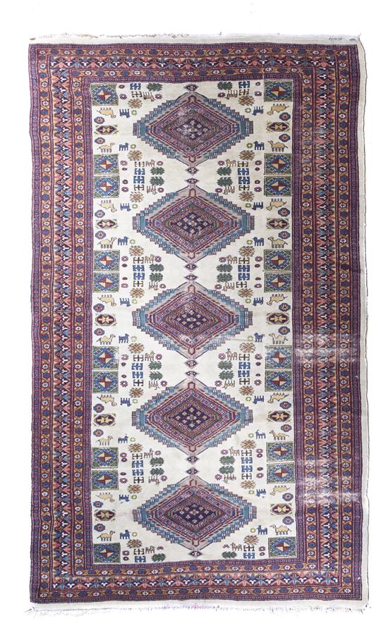 A Persian Wool Rug having five