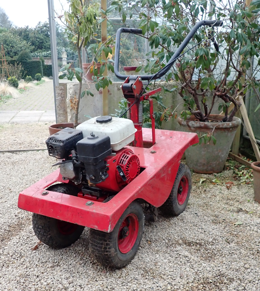 A PETROL TURF CUTTER with twin