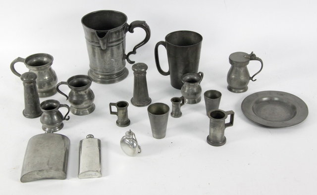 A pewter quart jug engraved beneath