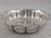 A pierced lobed silver fruit bowl