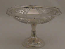 A pierced silver cake stand with