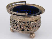 A pierced silver swing handled