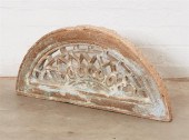A PIERCED STONE ARCHED ARCHITE