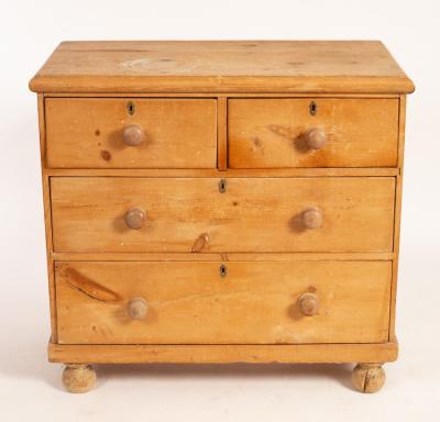 A pine chest of drawers fitted