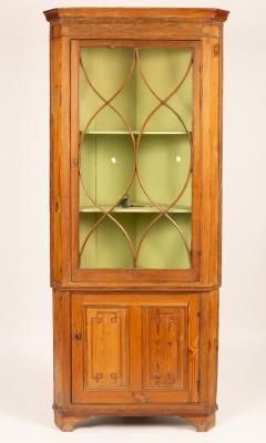 A pine corner cupboard with