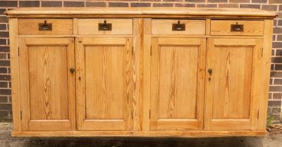 A pine cupboard enclosed by a