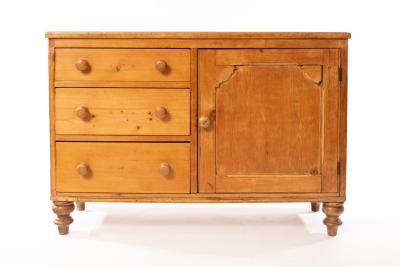 A pine dresser base fitted three