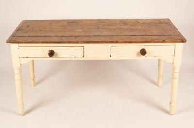 A pine kitchen table fitted two