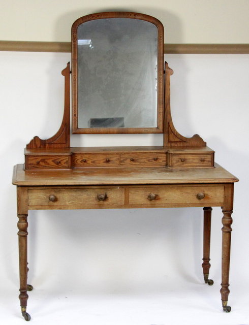A pine mirror-back dressing table