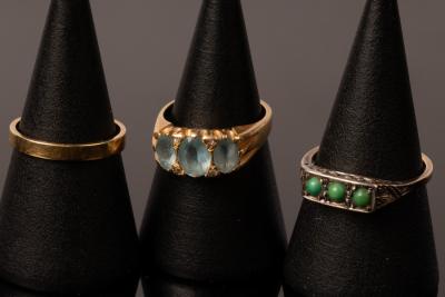 A plain 18ct gold wedding band,