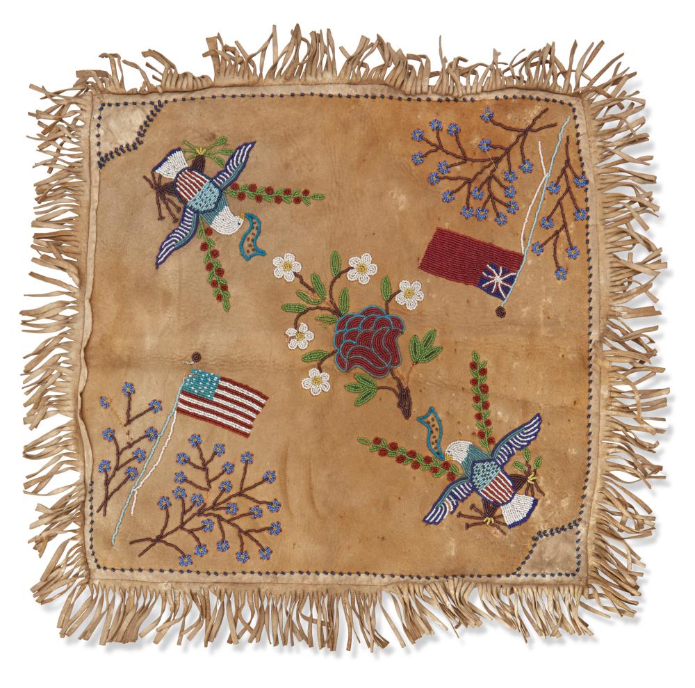A PLAINS BEADED HIDE CUSHION COVERA