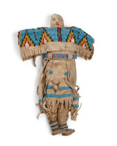 A PLAINS BEADED HIDE DOLL<br>A