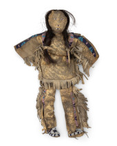A PLAINS BEADED HIDE DOLL<br>A
