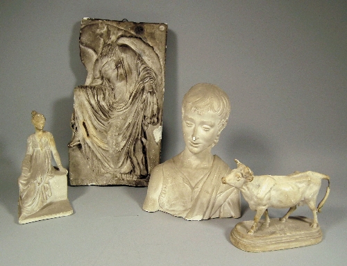A plaster model of a standing cow