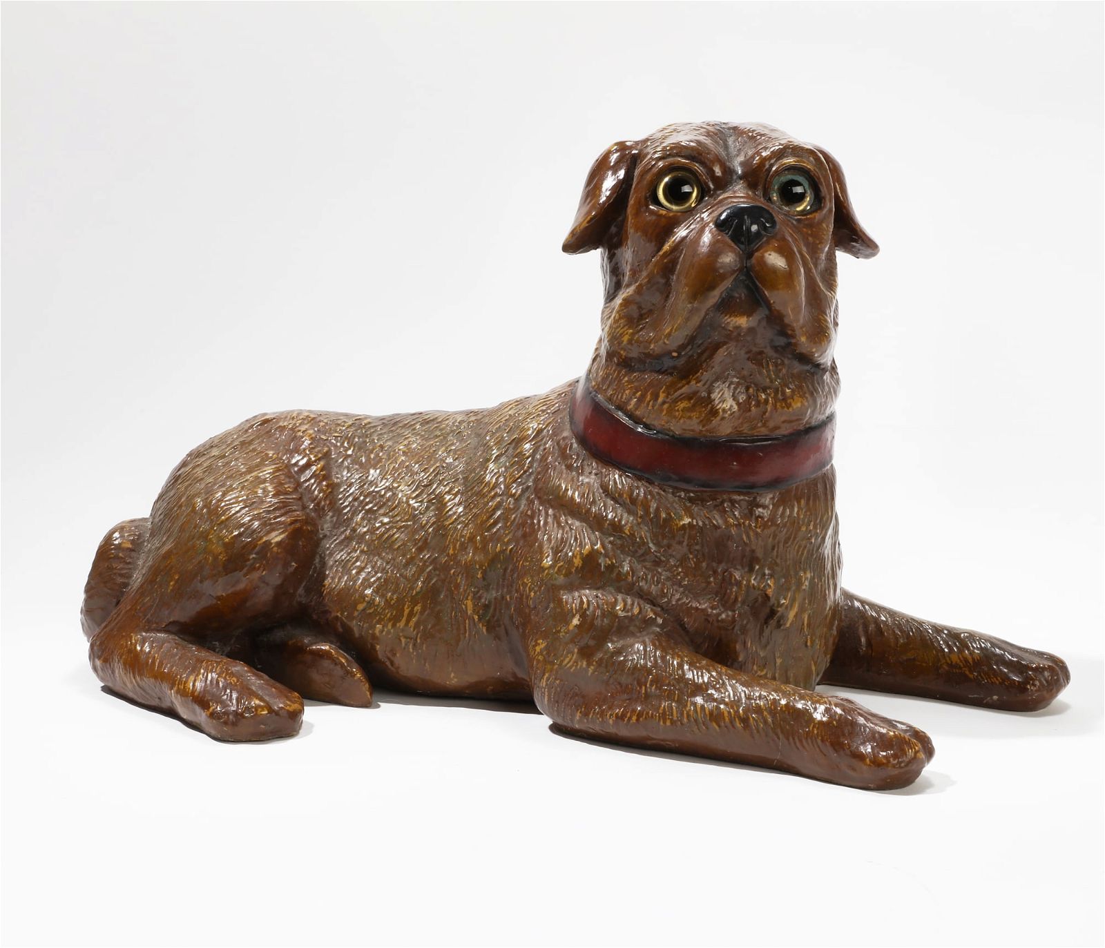 A PLASTER MODEL OF A RECUMBENT PUGA