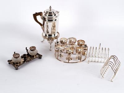 A plated egg cup stand fitted six