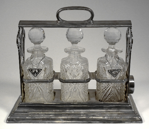 A plated framed three bottle