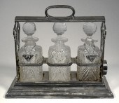 A plated framed three bottle t