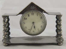 A plated mantel clock the dial
