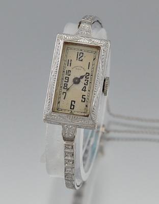 A Platinum, 14k Gold and Diamond