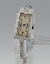 A Platinum, 14k Gold and Diamo