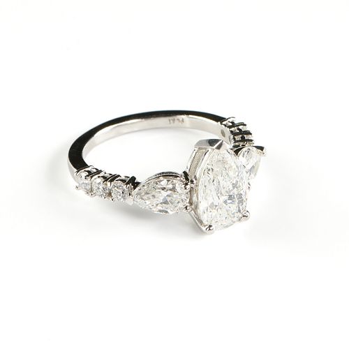 A PLATINUM AND PEAR CUT DIAMOND