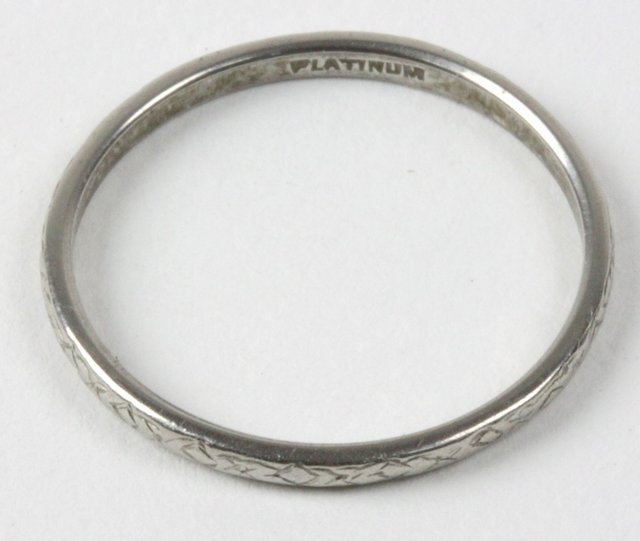 A platinum wedding band chased with