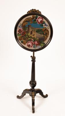 A pole screen with gilded ribbon