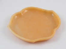 A polished soap stone dish