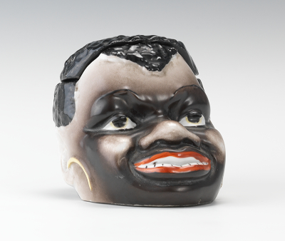 A Porcelain African Character
